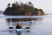 Four paddlers kayaking off of Orcas Island.