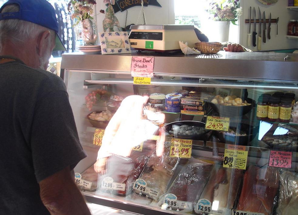 A man looking over the seafood on offer at Friday Harbor Seafood